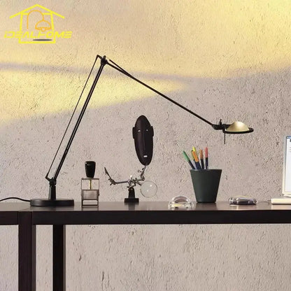 Black rocker arm desk light with chrome accents featuring an adjustable arm for office task lighting decorbites industrial black
