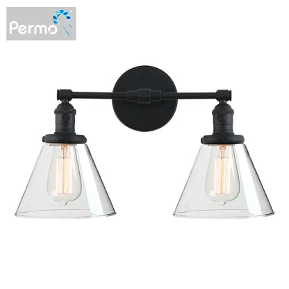 Black metal wall sconce with double cone glass clear shades and exposed filament bulbs for industrial bedroom lighting