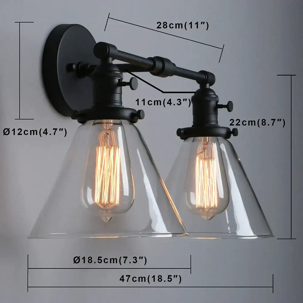 Industrial black double cone glass wall sconce with black metal frame and exposed filament bulbs for bedroom lighting