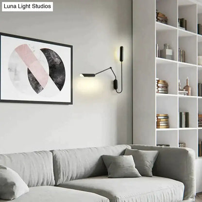 Black articulated emma industrial wall sconce with minimalist design and warm led lighting for bedroom reading light