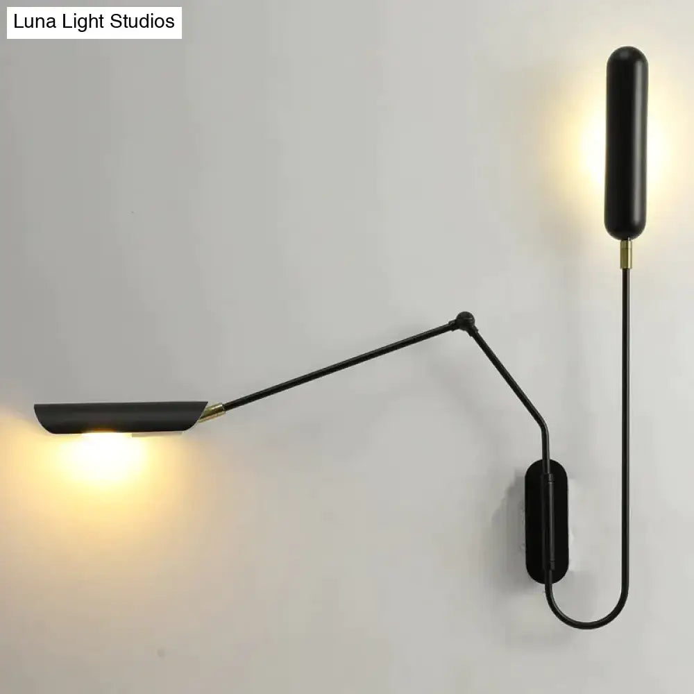 Black matte emma industrial wall sconce with articulated arm and brass accents ideal for bedroom reading light