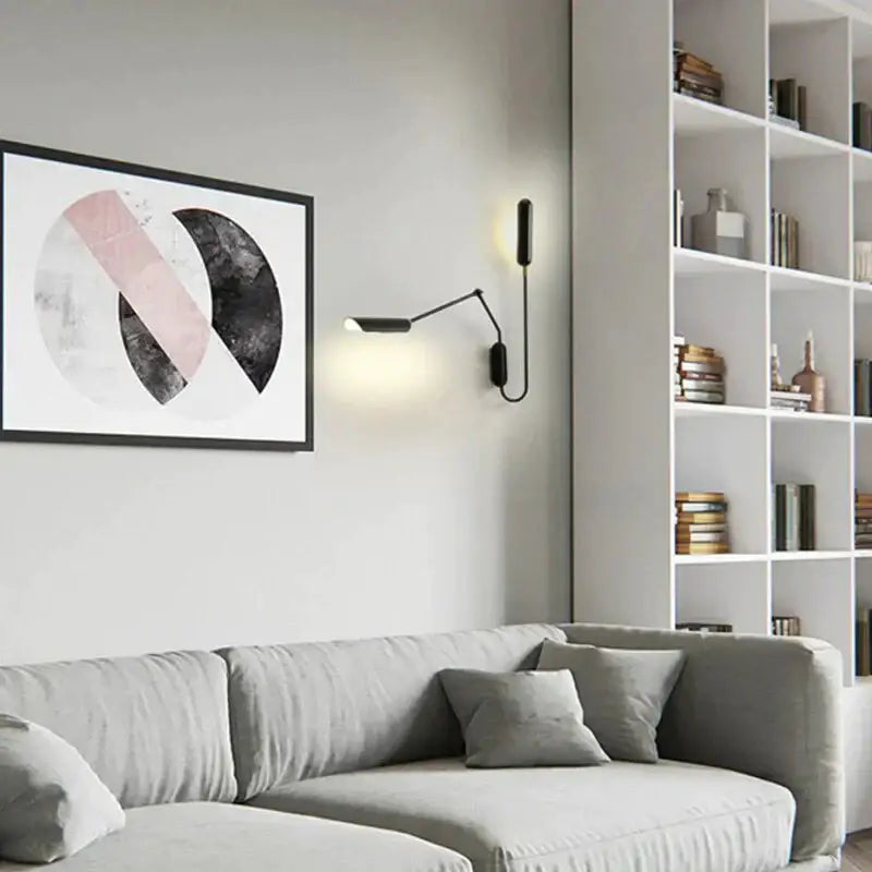 Black minimalist emma industrial wall lamp with slender articulated arm and warm light for bedroom reading