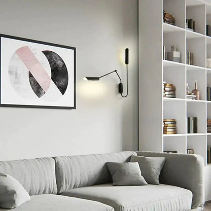 Black minimalist emma industrial wall lamp with slender articulated arm and warm light for bedroom reading