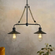 Black DecorBites™ farmhouse wire cage pendant light with two bulbs, rope suspension, and metal flared shades for island lamp use