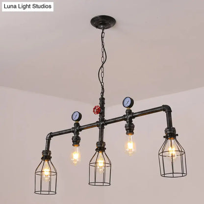 Industrial black gauge metal island lighting chandelier with four exposed filament bulbs, wire cages, blue gauges, and red valve