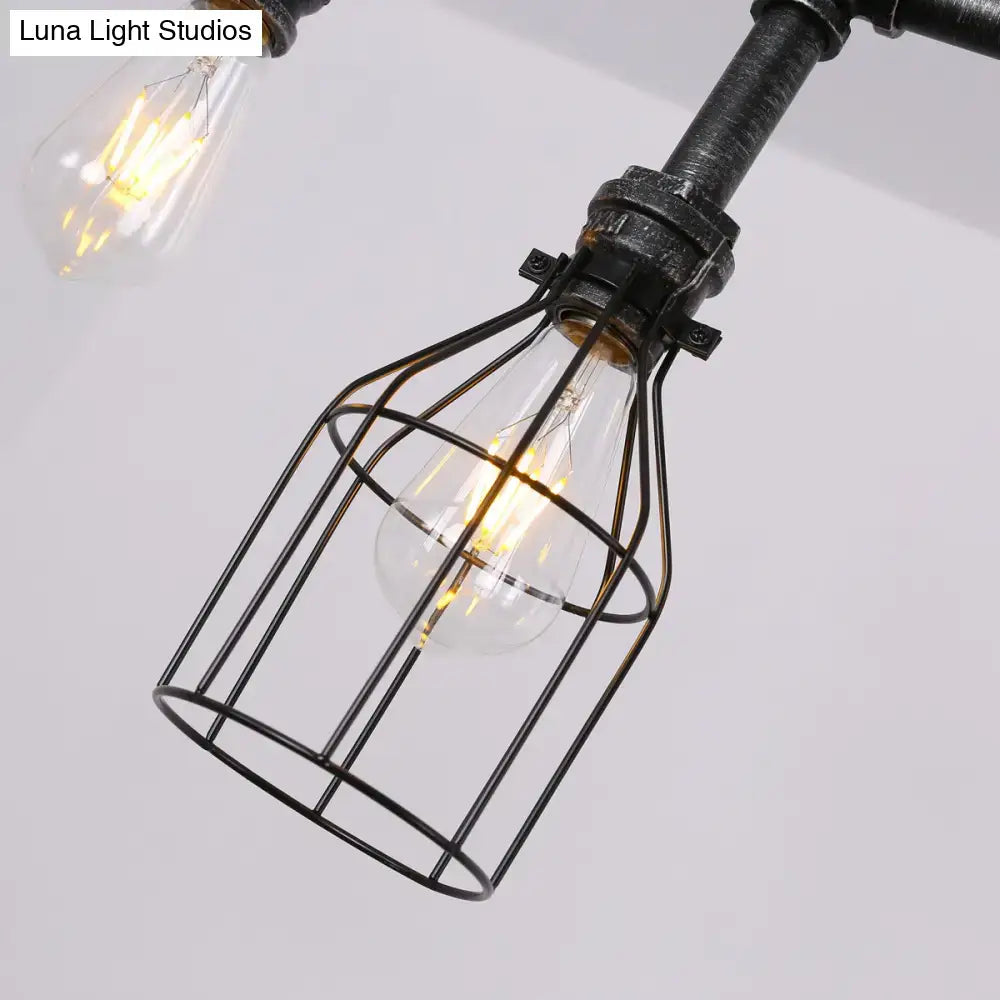 Industrial black gauge metal island lighting chandelier featuring a glowing filament bulb in a black metal cage