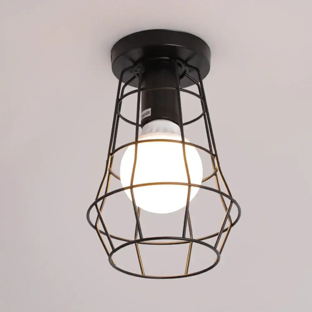 Industrial black geometric cage flush mount ceiling light with black metal frame and glowing white bulb decorbites industrial black