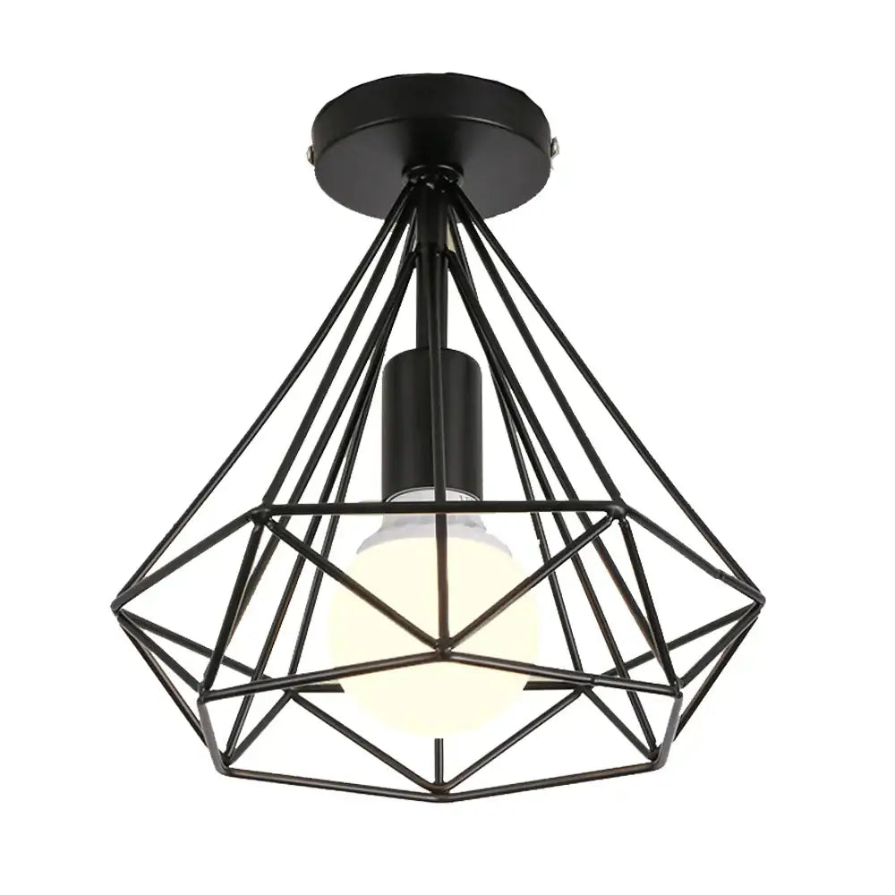 Black metal geometric cage pendant light with warm glowing bulb for dining room decorbites industrial led style