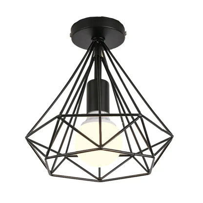 Black metal geometric cage pendant light with warm glowing bulb for dining room decorbites industrial led style