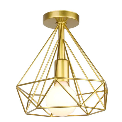 Gold-colored geometric wireframe pendant light with frosted bulb for dining room decorbites industrial led style