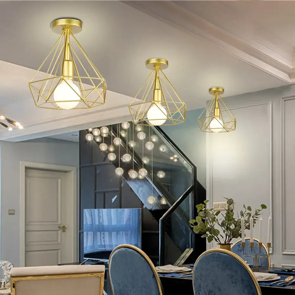 Gold geometric cage pendant light with exposed bulbs featuring decorbites industrial led design for dining room decor