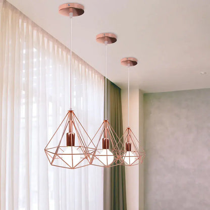 Three rose gold geometric pendant lights with diamond wireframe and frosted bulbs for decorbites industrial led pendant use