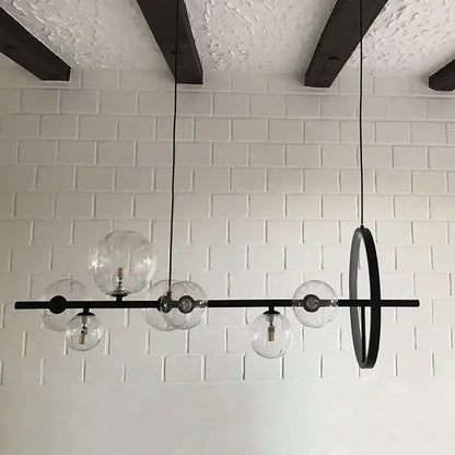 Industrial black glass bubble chandelier with clear glass globe bulbs and circular accent for dining room decorbites glass bubble