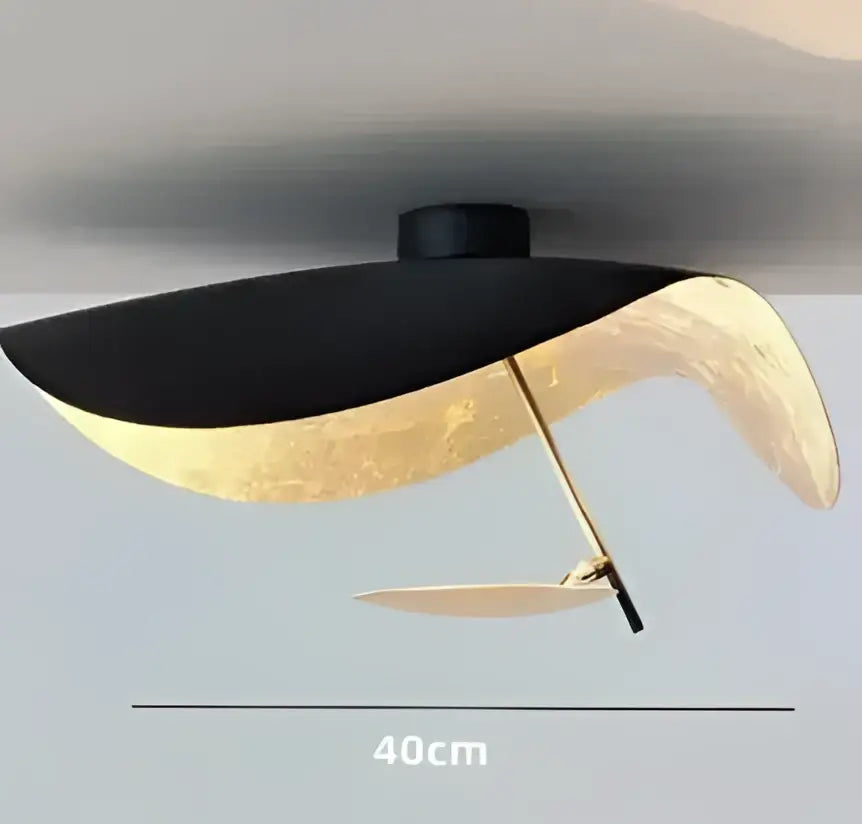 Industrial black and gold lotus leaf pendant light with sleek modern design suitable for dining room decorbites lederam manta
