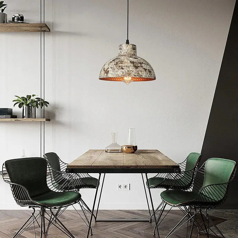 Industrial black hammered metal pendant lamp with distressed finish and warm copper interior for kitchen dining room decorbites industry style