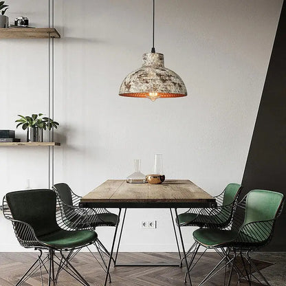 Industrial black hammered metal pendant lamp with distressed finish and warm copper interior for kitchen dining room decorbites industry style