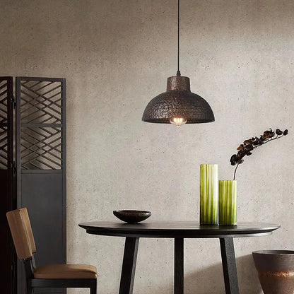 Industrial black hammered metal pendant lamp with dark textured finish for kitchen dining room decorbites industry style