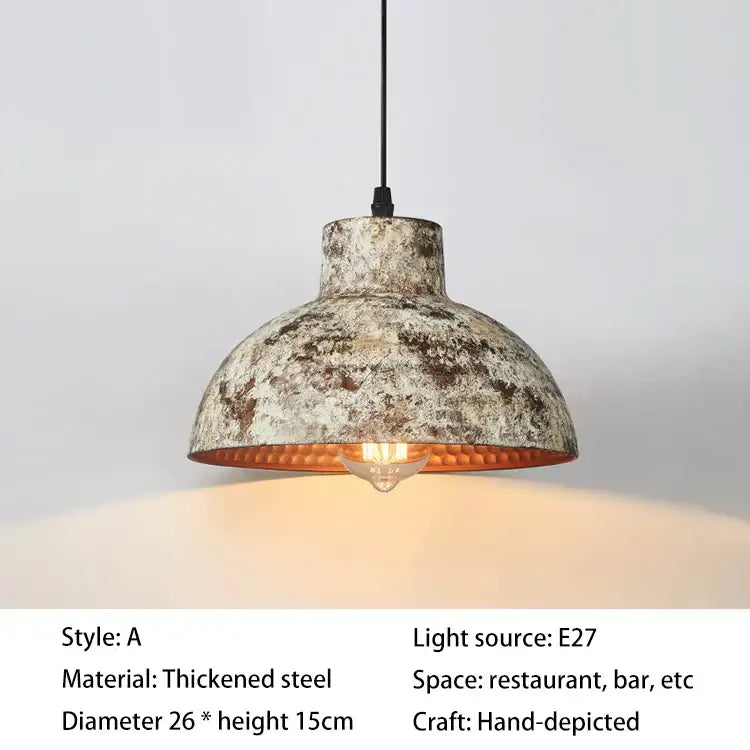 Industrial black hammered metal pendant lamp with distressed steel finish and orange gold interior for kitchen dining room decorbites industry style