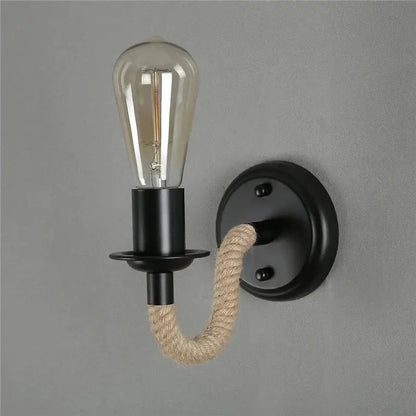 Black metal wall lamp with beige decorbites hemp rope arm and exposed filament bulb for industrial living room sconce