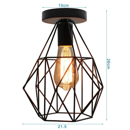Industrial black iron aisle ceiling lamp featuring a black geometric wire cage and a glowing amber filament bulb by decorbites iron aisle