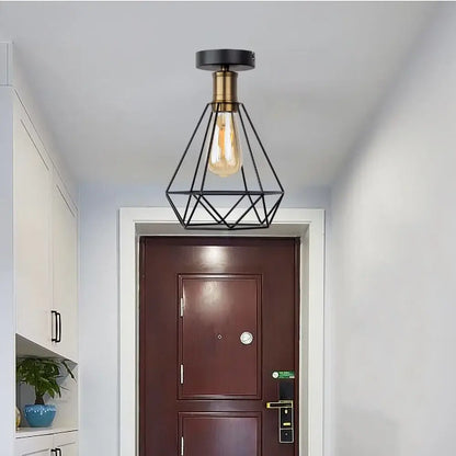 Black geometric metal pendant ceiling light with brass base and exposed edison bulb decorbites iron cage led fixture