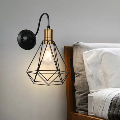 Industrial black iron cage wall sconce with brass accents and geometric design for bedroom decorbites iron cage wall lighting