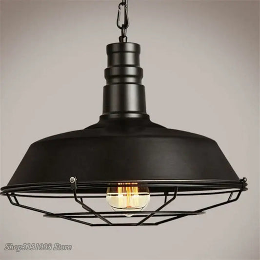 Black industrial iron pendant light with matte dome and wire cage housing exposed bulb for dining room decorbites iron pendant lights