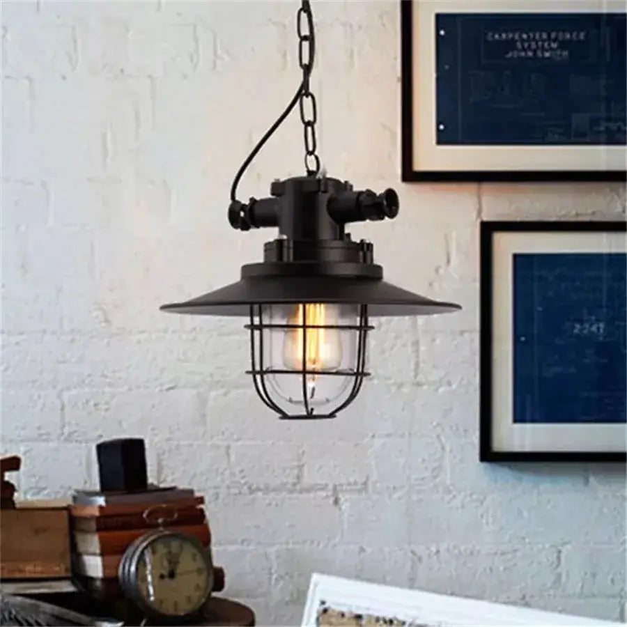Industrial black iron pendant lights featuring cage design and exposed bulb for kitchen decorbites industrial iron pendant