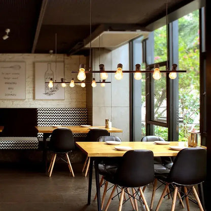 Industrial black kitchen island chandelier with multiple exposed edison bulbs on a dark metal bar for decorbites industrial kitchen island lighting