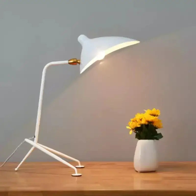 White minimalist desk lamp with sleek curved arm and gold joint complementing decorbites adjustable arm floor lamp