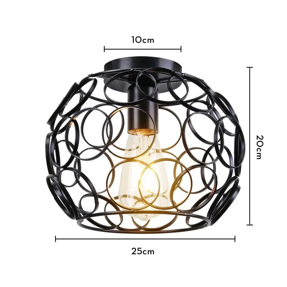 Black wrought iron industrial led ceiling light with spherical cage design and exposed Edison bulb for kitchen decorbites