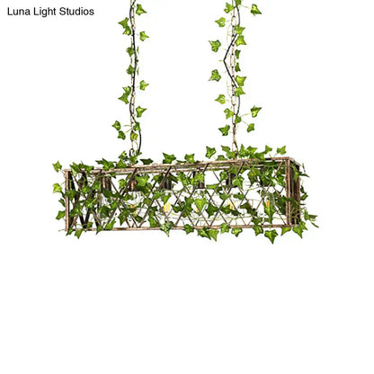 Rectangular industrial black metal cuboid plant island light fixture with rustic woven lattice and green ivy vines