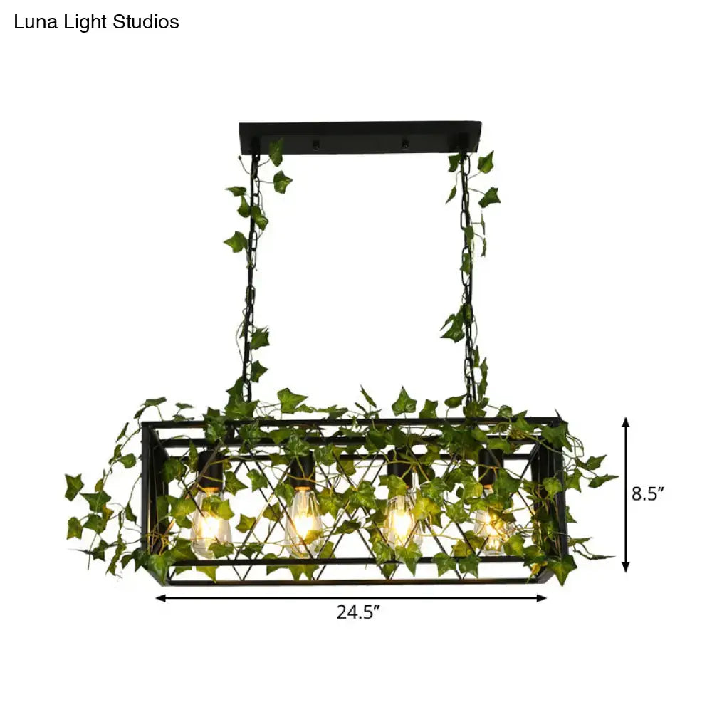 Industrial black metal cuboid plant island lamp featuring a rectangular light fixture with ivy vines and four bulbs
