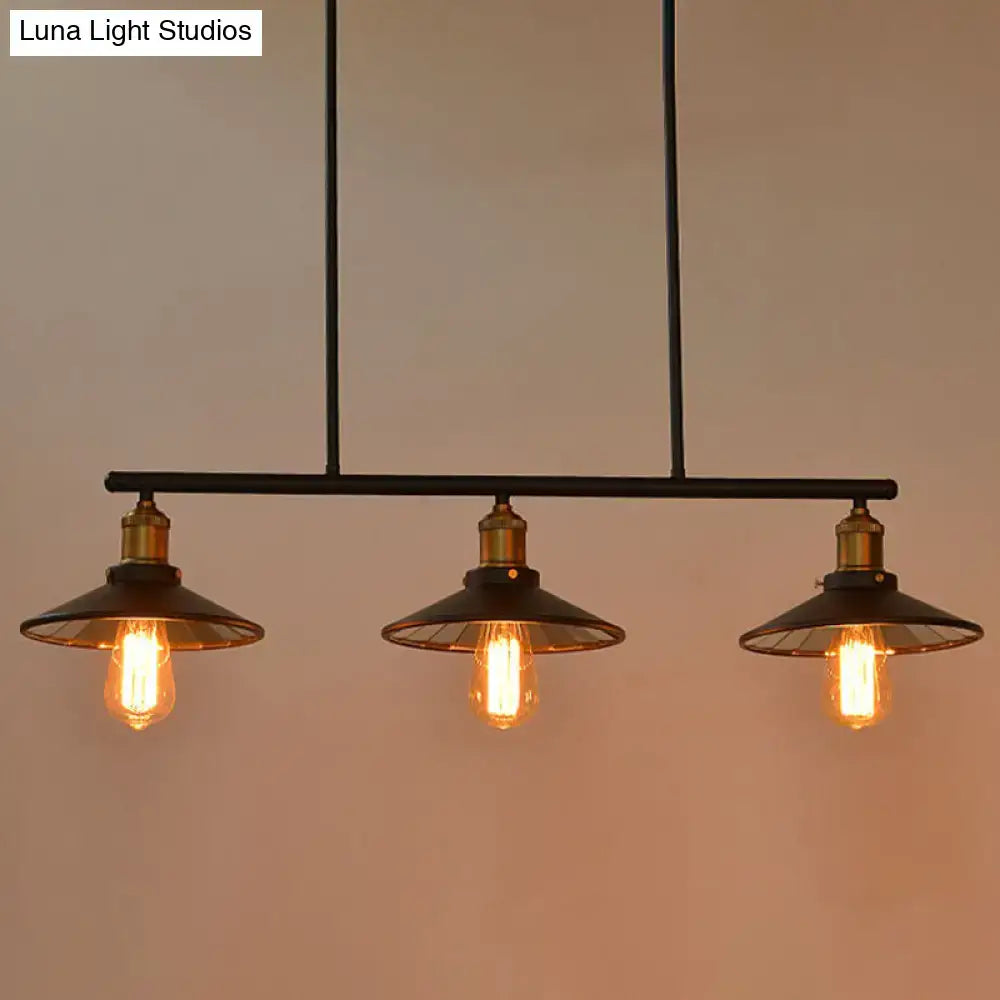 Industrial black metal island pendant with cone shade and three exposed edison bulbs for dining room lighting