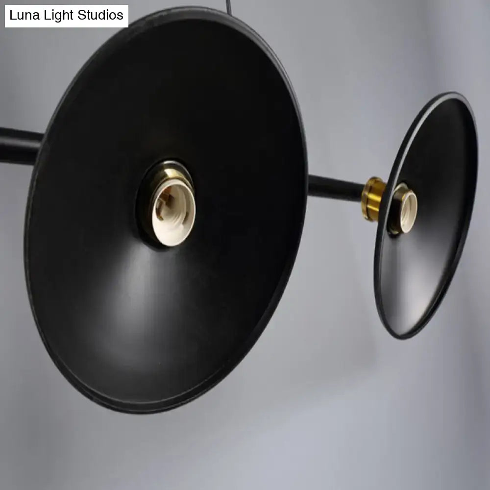 Industrial black metal island pendant with cone shade and brass-colored sockets for dining room lighting