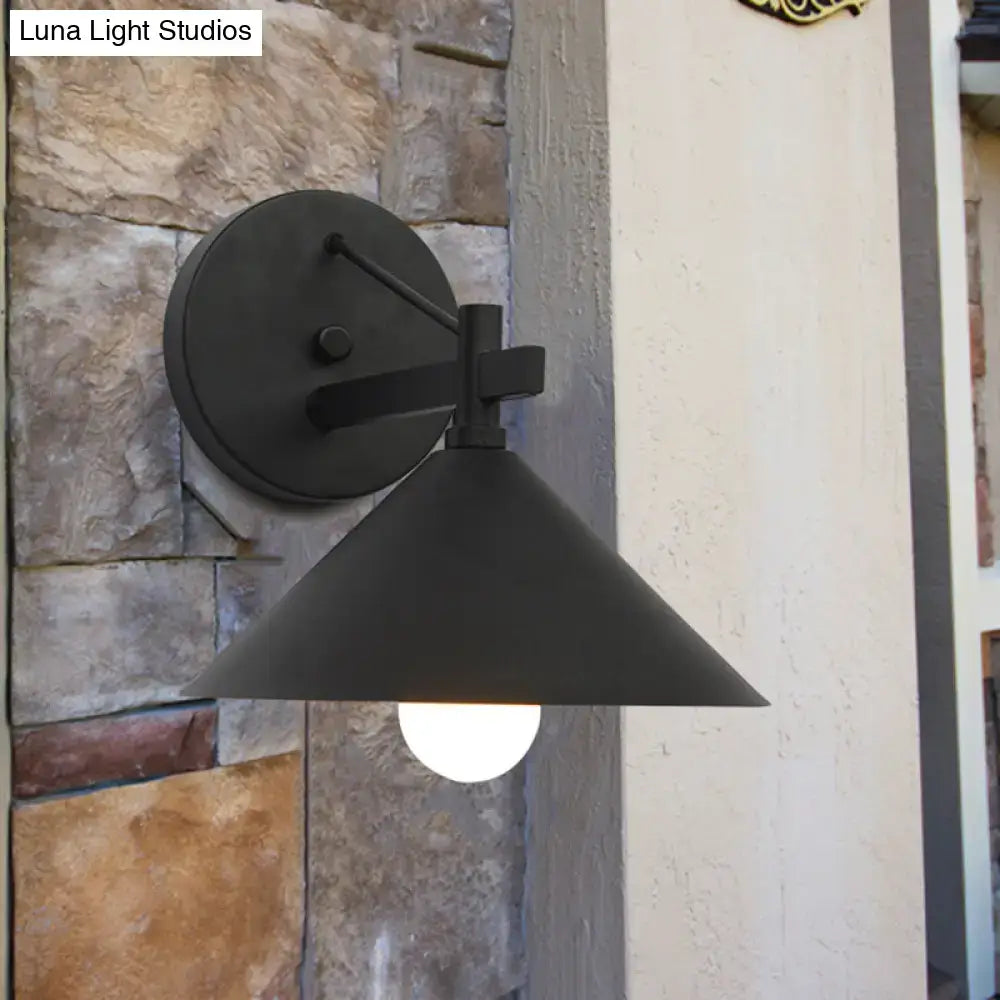 Black matte metal wall hanging light with conical shade and minimalist industrial design from DecorBites outdoor collection