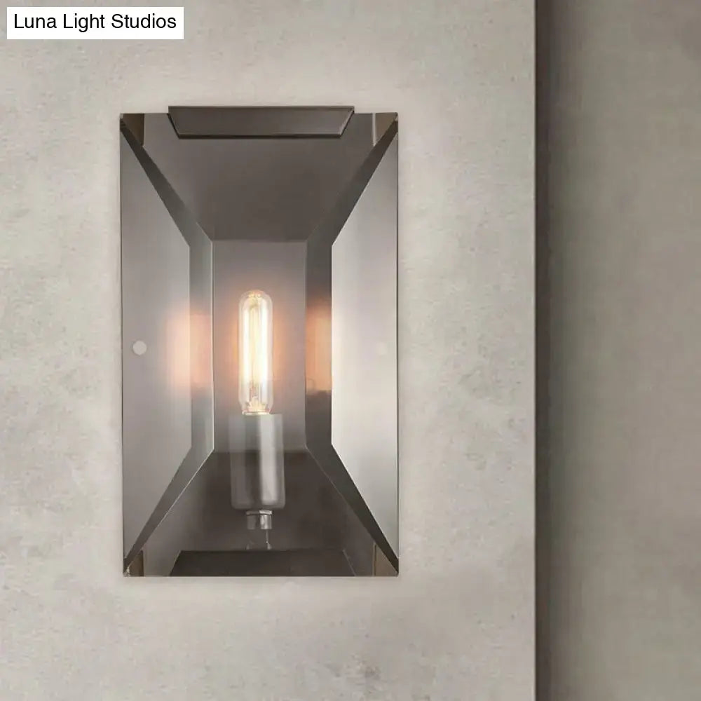 Modern industrial black metal wall mounted sconce light with sleek brushed metal frame and exposed filament bulb