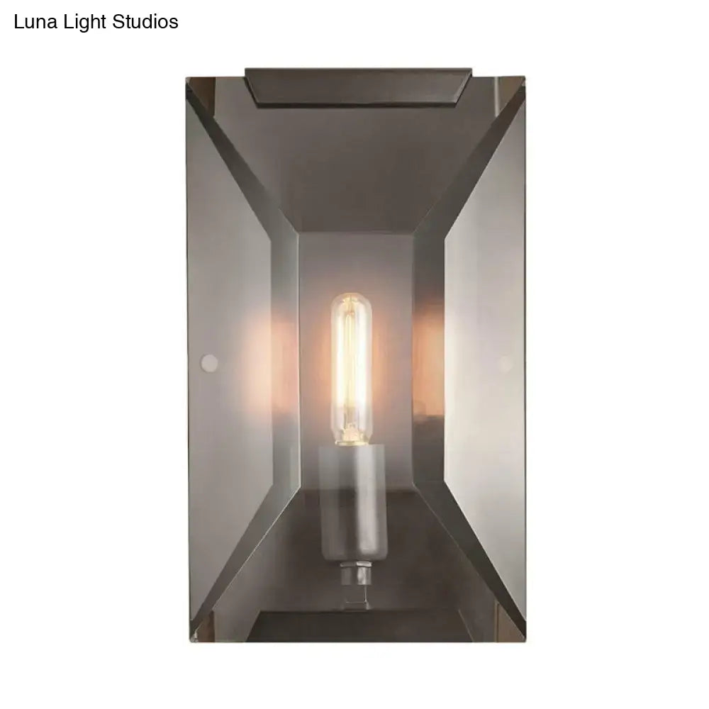 Modern rectangular wall mounted sconce light with brushed bronze finish, clear glass panels, and exposed filament bulb