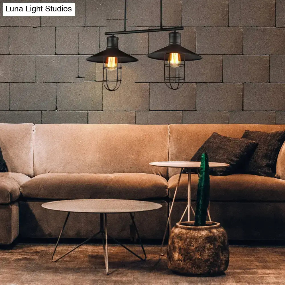 Decorbites™ nautical saucer island pendant lamp with black wire cage shade and exposed filament bulbs above sofa