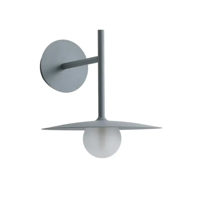 Modern gray wall lamp with sleek minimalist style featuring a circular base and disc-shaped shade cradling a spherical bulb