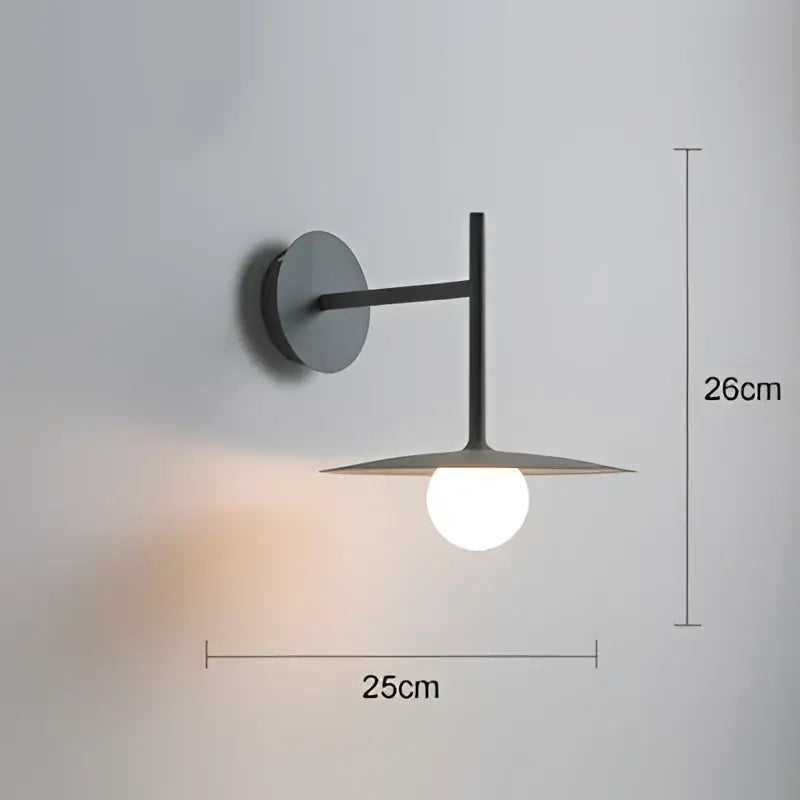 Modern black metal industrial minimalist wall lamp with sleek design and warm glow as a stylish wall sconce