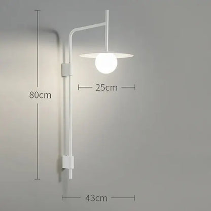 Industrial black minimalist wall lamp with a sleek curved arm and frosted glass globe shade style wall sconce