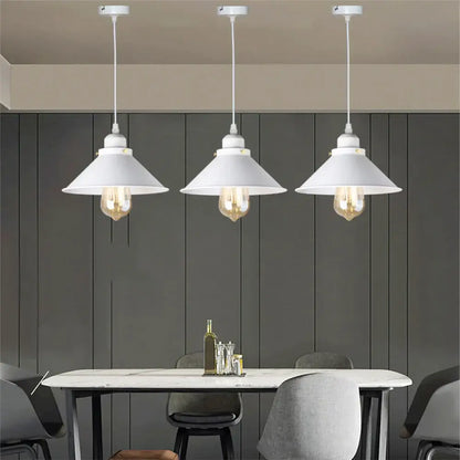 Three white pendant lights with conical shades featuring exposed Edison bulbs in decorbites industrial black pendant style