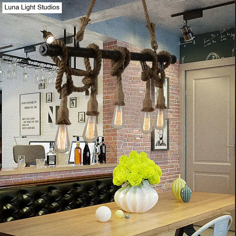 Industrial black pipe and rope chandelier with exposed edison bulbs for linear restaurant island lighting