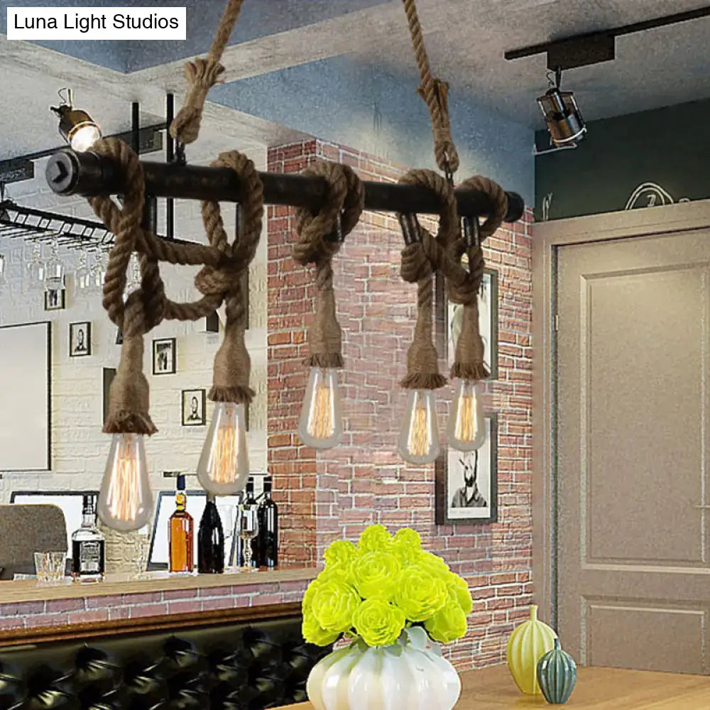 Industrial black pipe and rope chandelier with five edison bulbs for a linear restaurant island lighting fixture