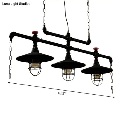 Industrial black pipe chandelier with three exposed bulbs and red valve caps for dining room lighting