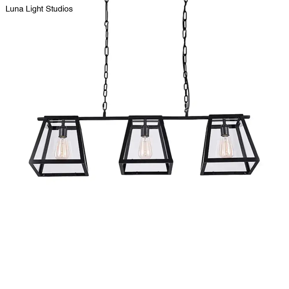 Decorbites black pyramid island light with three rectangular glass-encased bulbs in industrial metal design