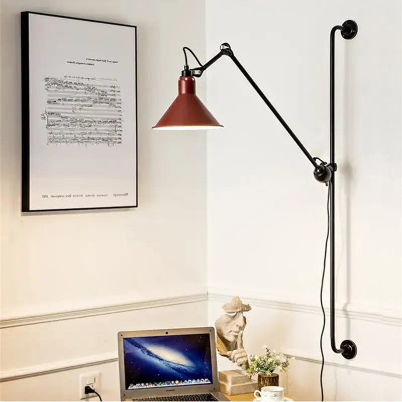 Industrial black and red swing arm wall lamp with matte black iron articulated arm and red metal shade for bedroom decorbites industrial iron swing