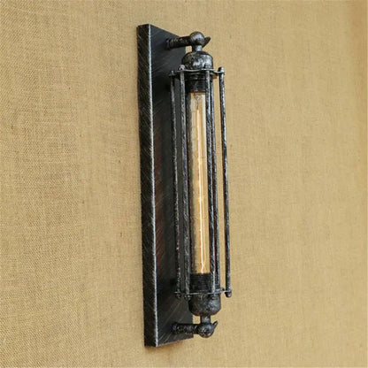 Industrial black rustic edison wall light with dark weathered metal frame and vertical bars encasing exposed filament bulb