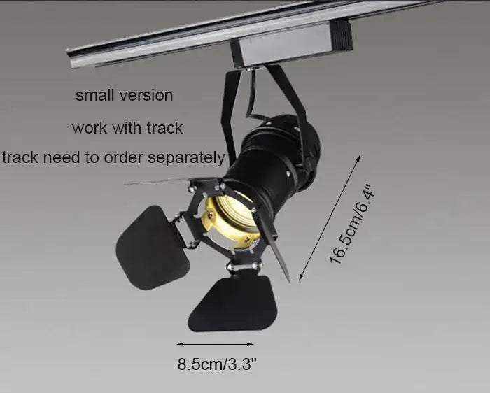 Black decorbites industrial spotlight with adjustable metal arms and gold-toned lens for commercial spotlight rail light